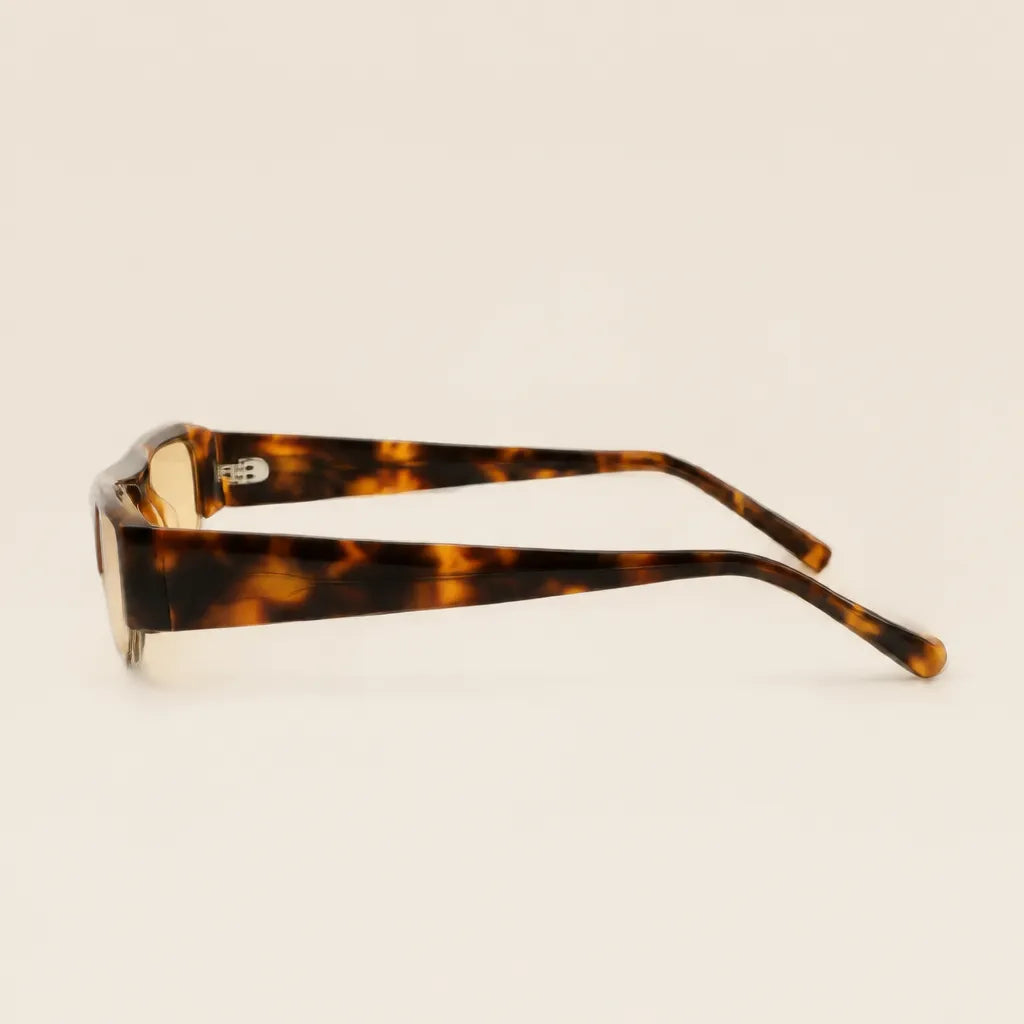 Side view of 2005 TOPAZ sunglasses showing tortoise acetate temples.